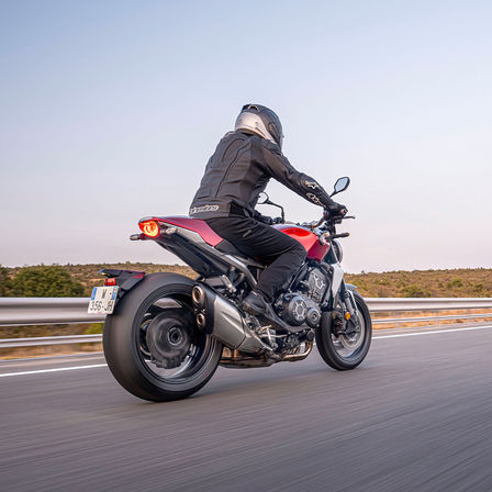 Honda CB1000R, 3-quarter rear right side, with rider, on the road