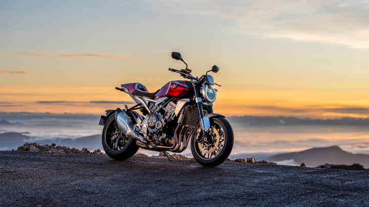 Honda CB1000R, 3-quarter front right side, parked, above the mountains