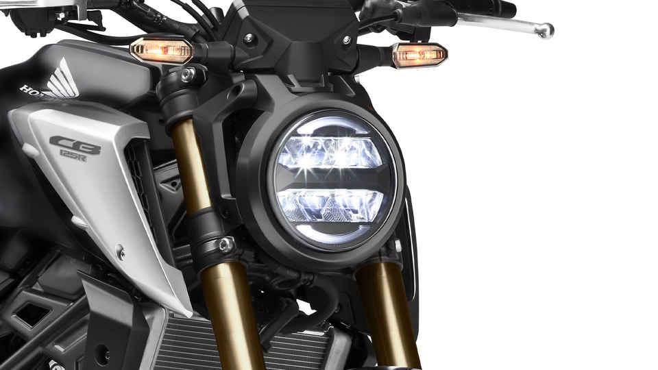 Honda CB125R, 3-quarter, front right side, zoom on lights, studio shot, black bike