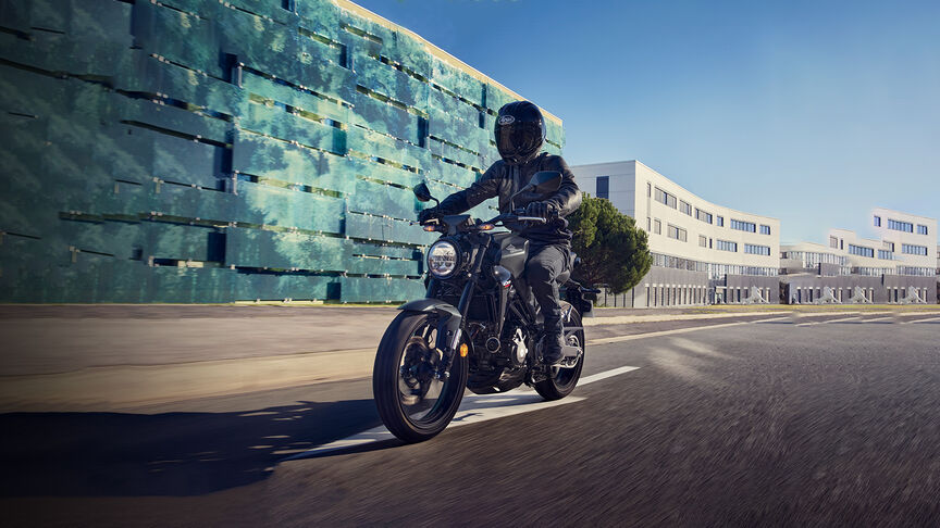 Honda CB300R Front facing three quarters being looked at by a women in a studio.