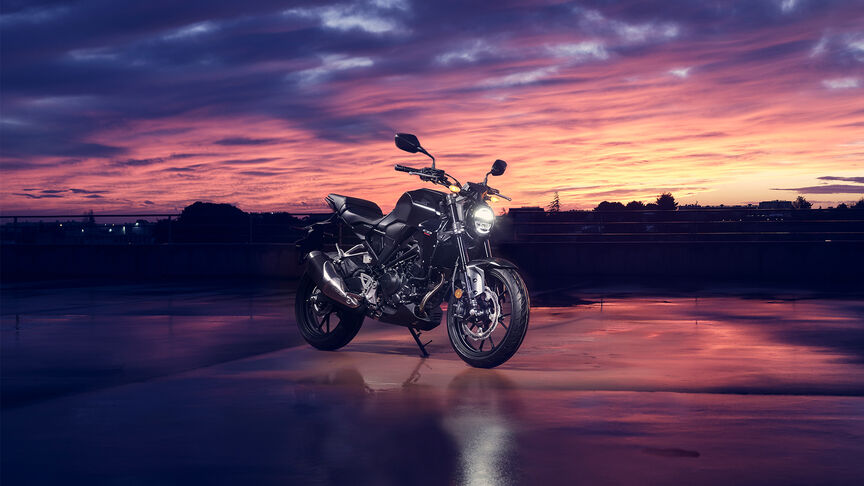 Honda CB300R Front facing three quarters being looked at by a women in a studio.