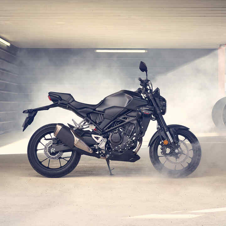 Honda CB300R Side facing parked in a dusty garage.