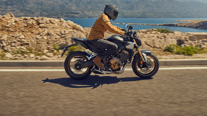 Honda CB650R front ¾ riding in car park