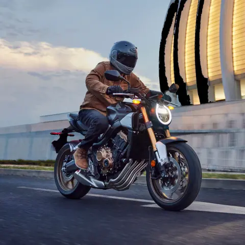 Honda CB650R on road at night with new headlight