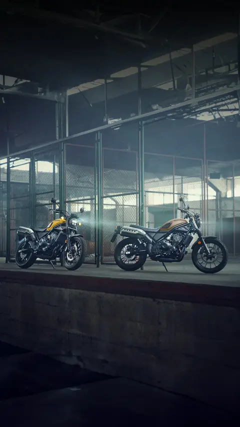 Honda CL500 motorcycles in a warehouse location.