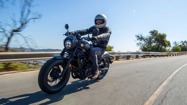 Rider on a Honda CMX500 Rebel in road location.