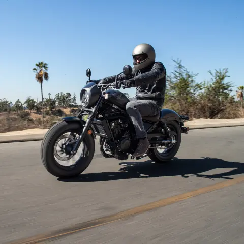 Honda CMX500 Rebel with male rider in road location. 