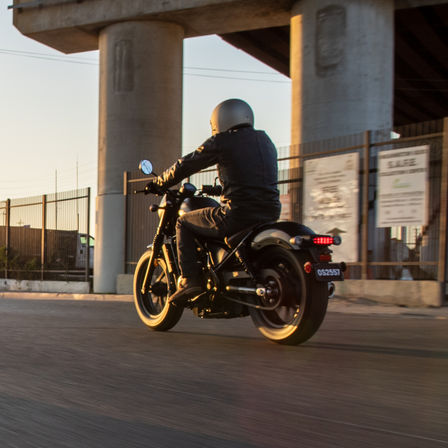 Rear three quarter shot of Honda CMX500 Rebel being ridden on street.