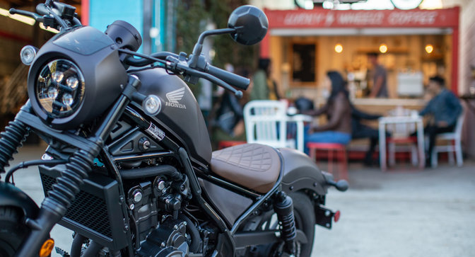 Front three-quarter facing Honda CMX500 Rebel, street location.