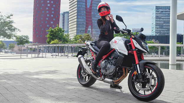 Honda CB750 Hornet static image with female rider.