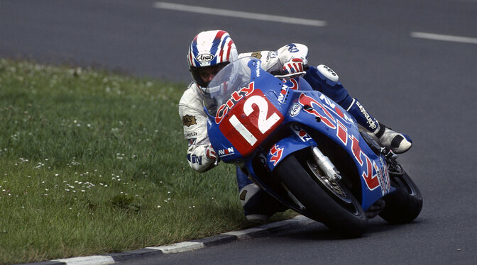 Honda 1996-1998 CBR900R with a rider on a race track. Photo credit: 1996 image - NK Photography 