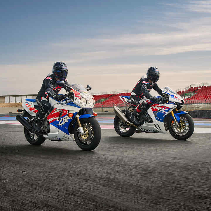 Two riders side facing on the Honda CBR1000RR-R-Fireblade on a race track