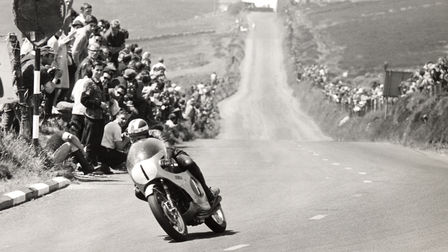 Honda Fireblade motorbike three-quarter view on race track with rider. Vintage image (Location).