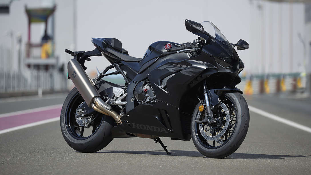 Honda CBR1000RR-R Fireblade, 3 quarter front right side, parked on racetrack, black bike