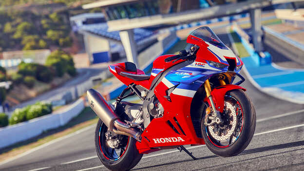 Honda CBR1000rr-r Fireblade front 3/4 parked on race track. 