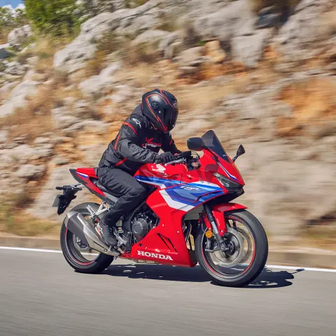 Honda CBR500R side on dynamic shot with rider