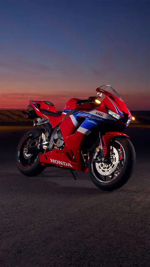 CBR600RR on track at sunset.