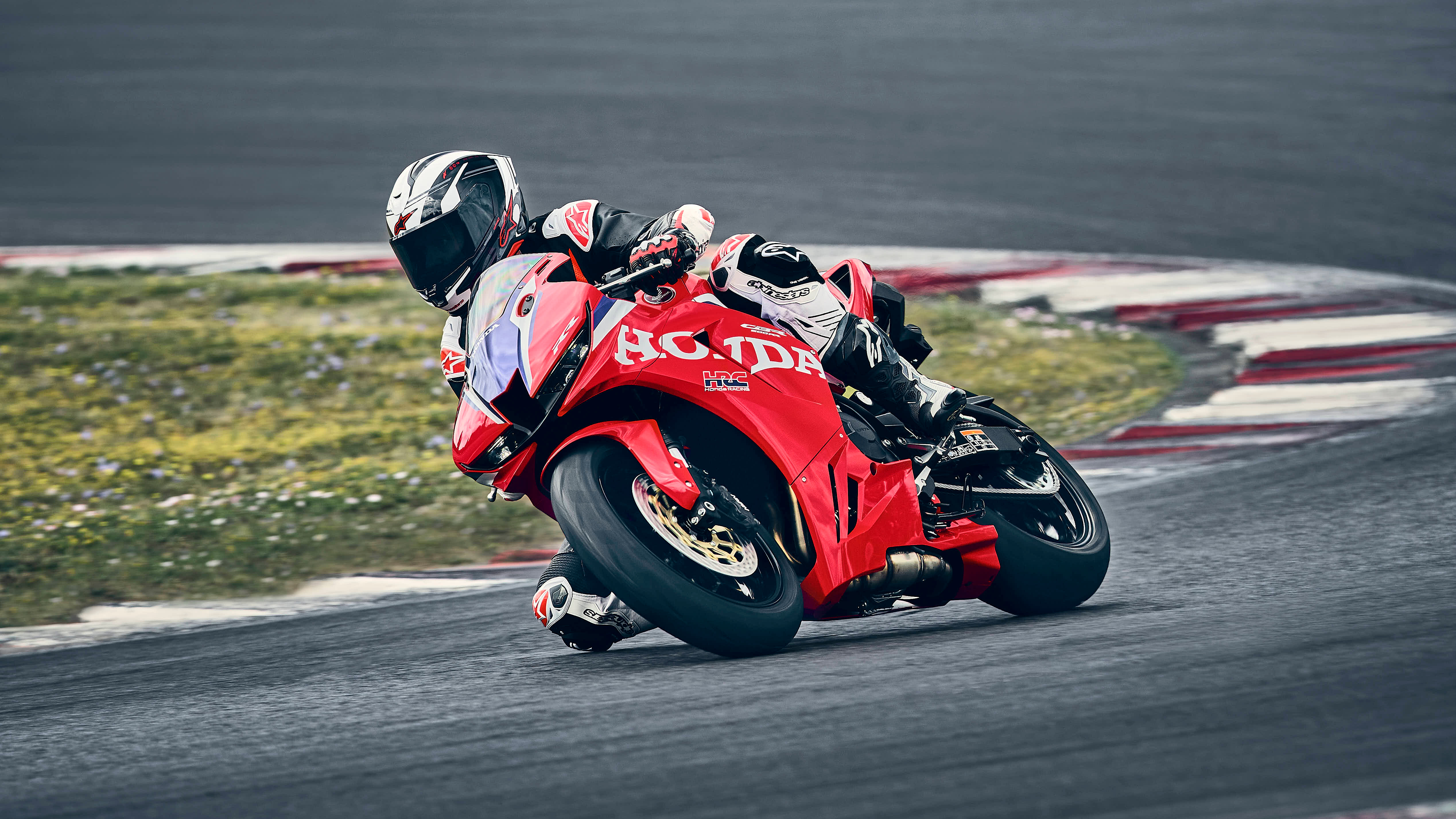 CBR600RR on track at sunset.
