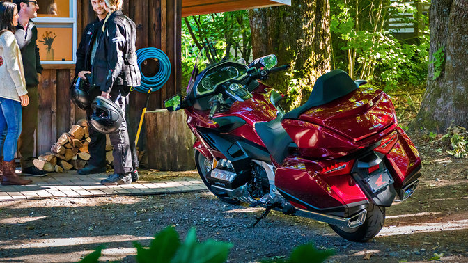 Honda Gold Wing parked in rural location.