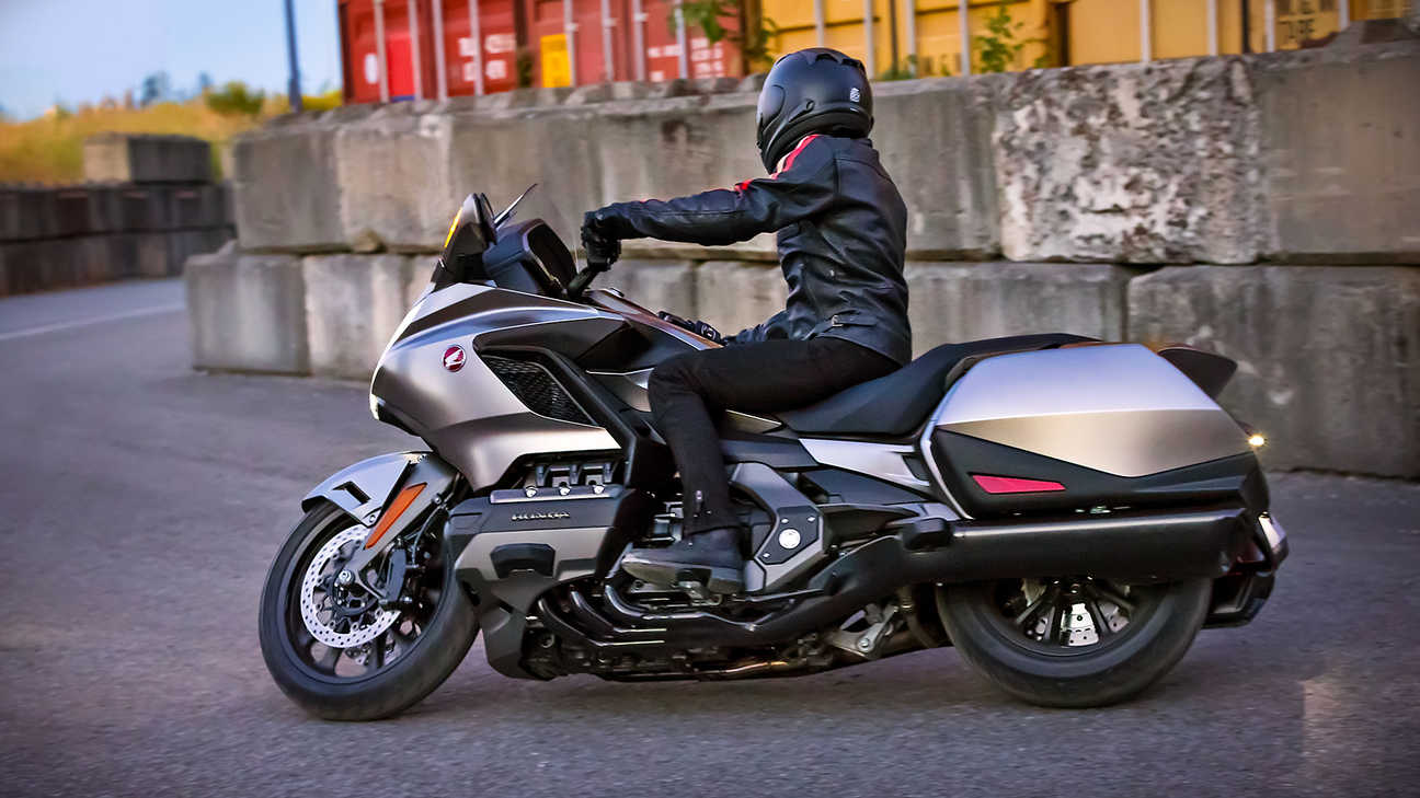 Side facing Honda Gold Wing with rider.