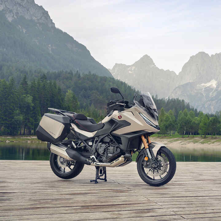 NT1100 static image on lake with panniers and top box