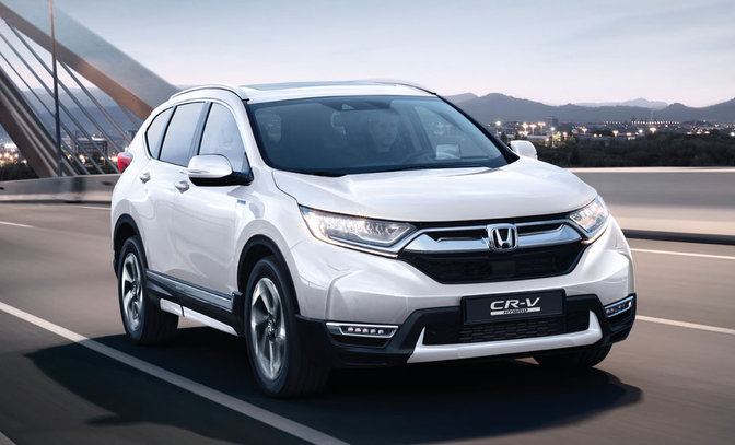 Front three-quarter facing Honda CR-V Hybrid with close up feature and logo.