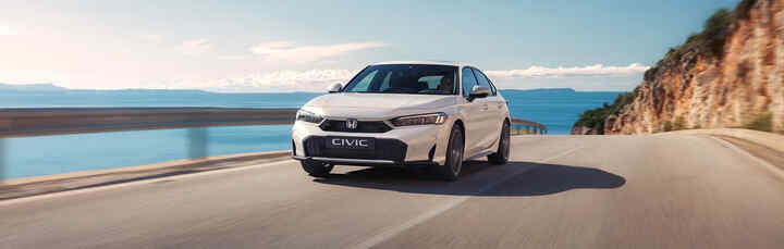 Honda e:Ny1 being driven in the countryside.