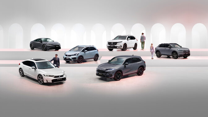 Honda electrified range including a grey Prelude, white CR-V, grey HR-V, white Jazz, blue ZR-V, and white Civic.