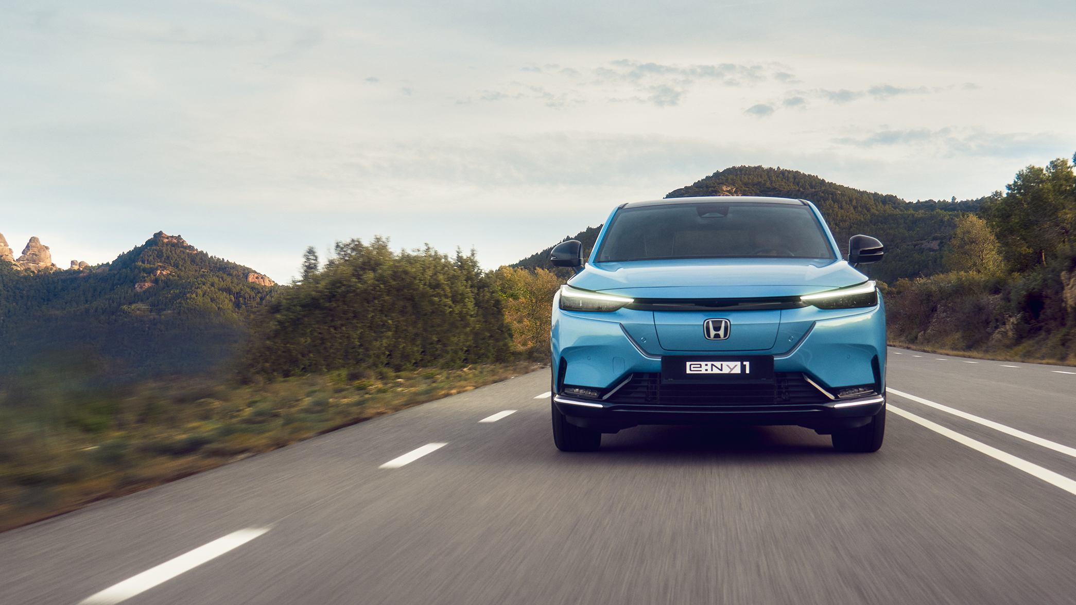 Blue e:Ny1 on a road front facing.