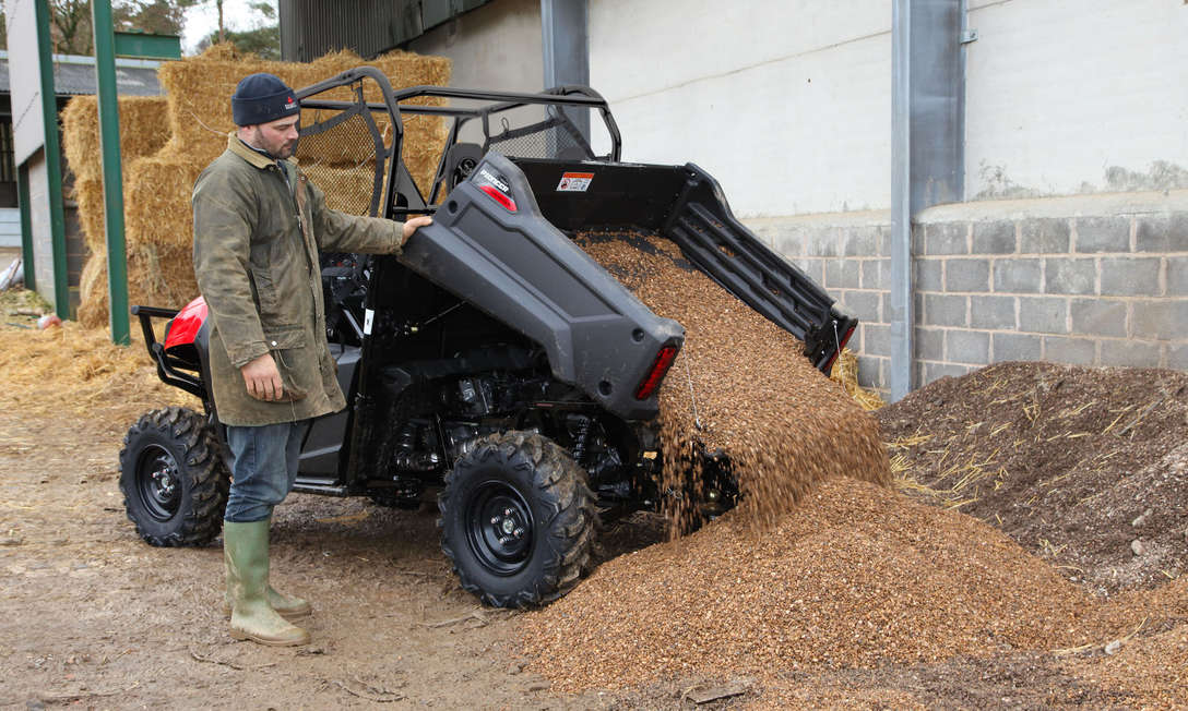 Rear facing Honda Pioneer ATV in action.