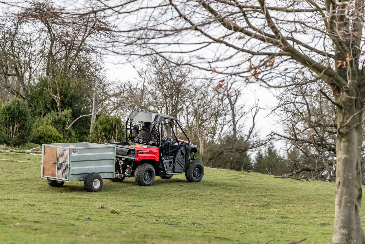 Picture of a honda Pioneer 520 being used to tow a trailer