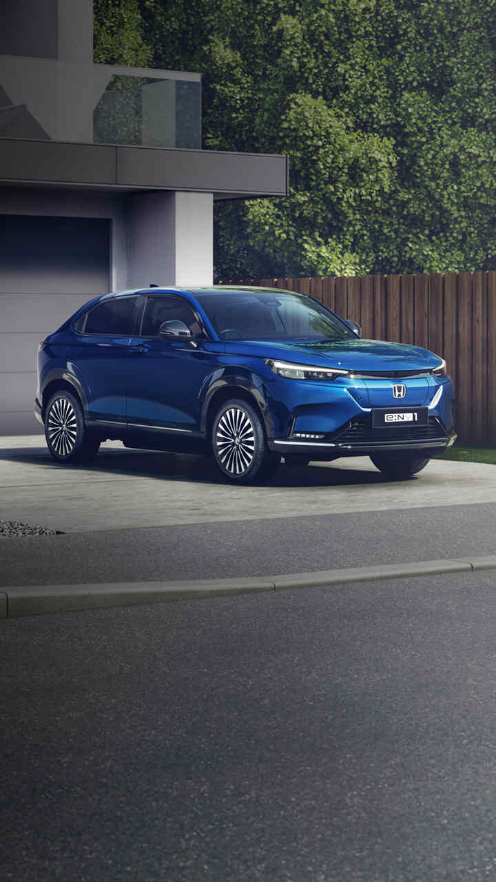 Honda e:Ny1 parked on a driveway.