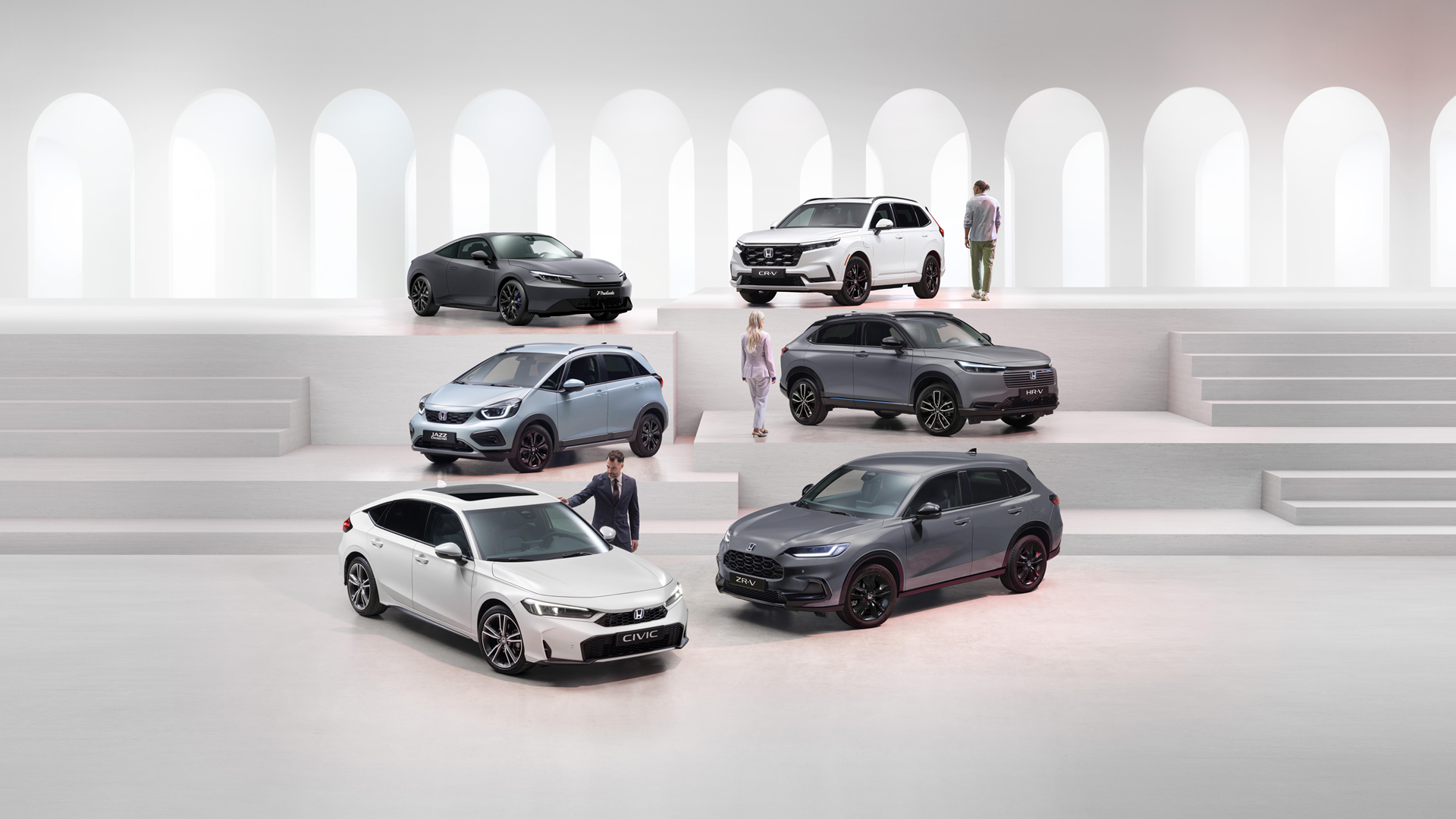 Honda electrified range including a grey Prelude, white CR-V, grey HR-V, fjord mist pearl Jazz Crosstar, grey ZR-V and white Civic.