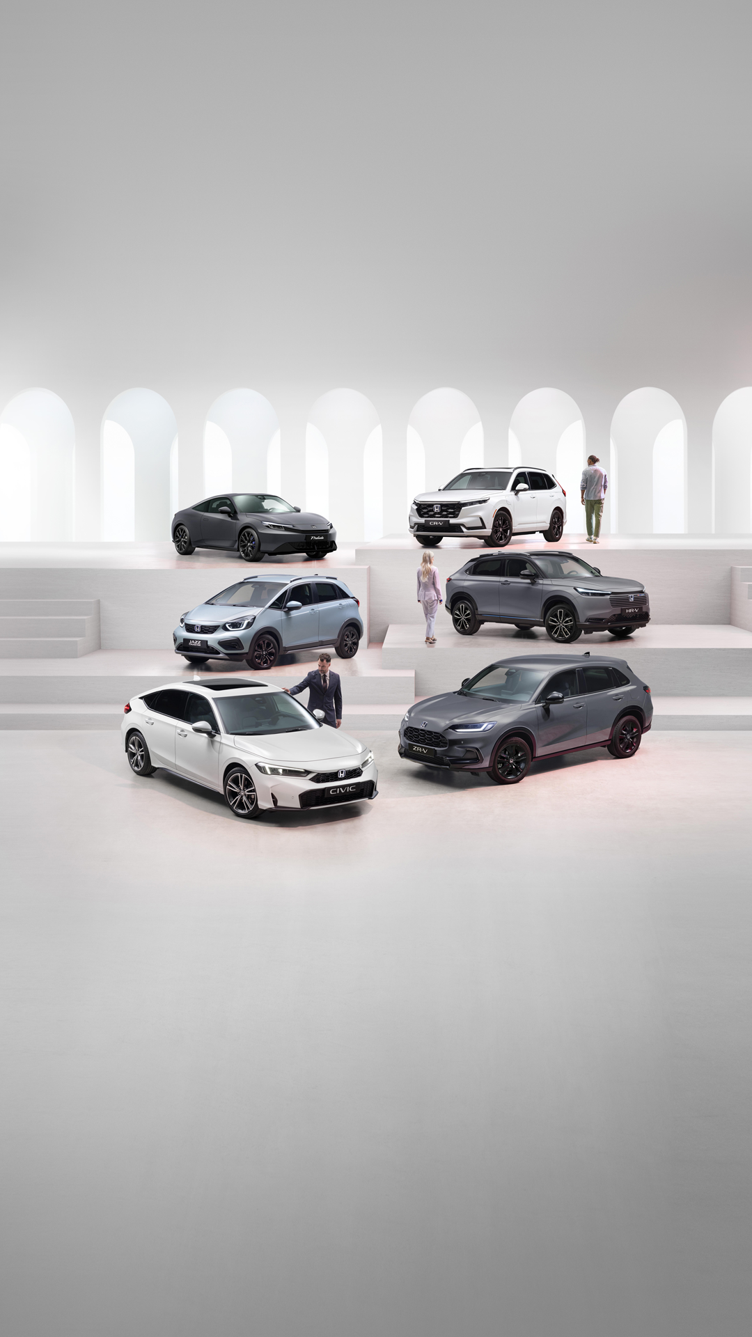 Honda electrified range including a grey Prelude, white CR-V, grey HR-V, fjord mist pearl Jazz Crosstar, grey ZR-V and white Civic.