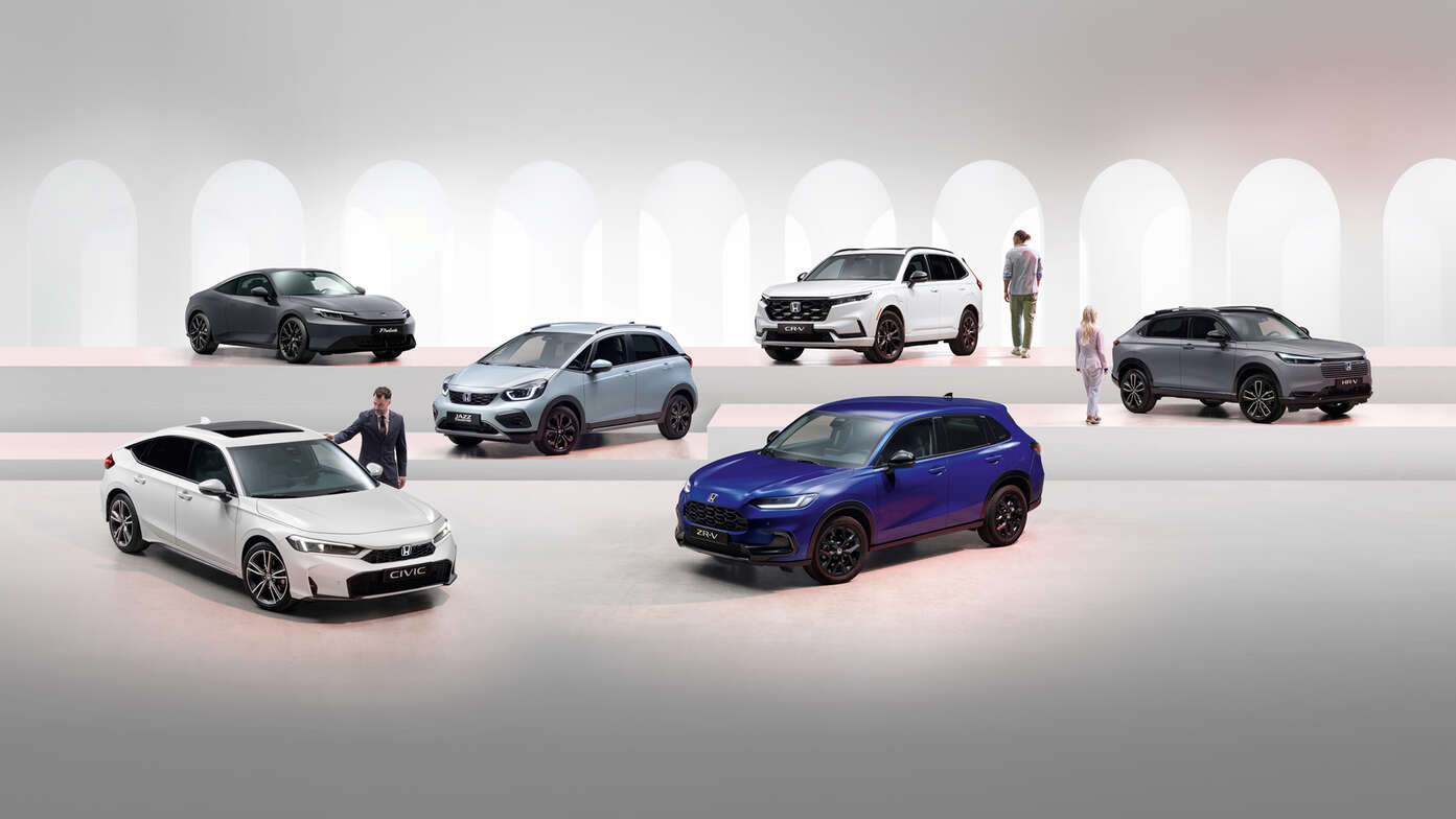 Honda electrified range including a grey Prelude, white CR-V, grey HR-V, white Jazz, blue ZR-V, and white Civic.