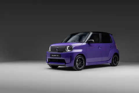 Honda Super-N in purple front 3/4 facing in a studio setting