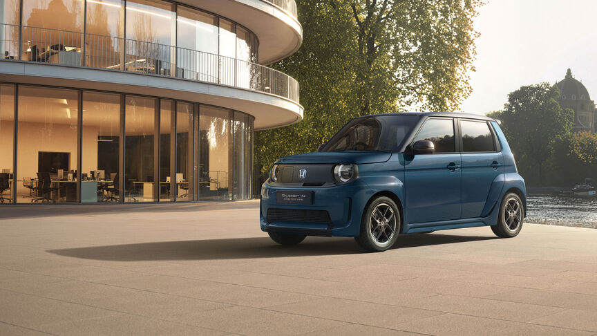 Front facing Honda Super-N by the lake.