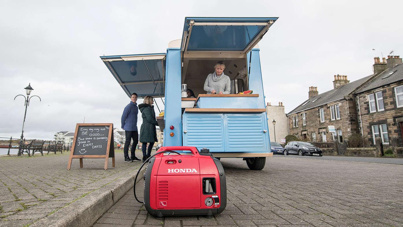 eu22i portable power generator powering a food truck and showcasing noise reducing panneling