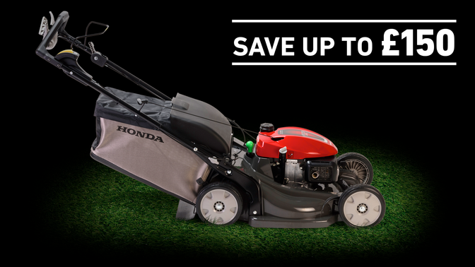 HRX lawnmower on grass in a dark background with save up to £150