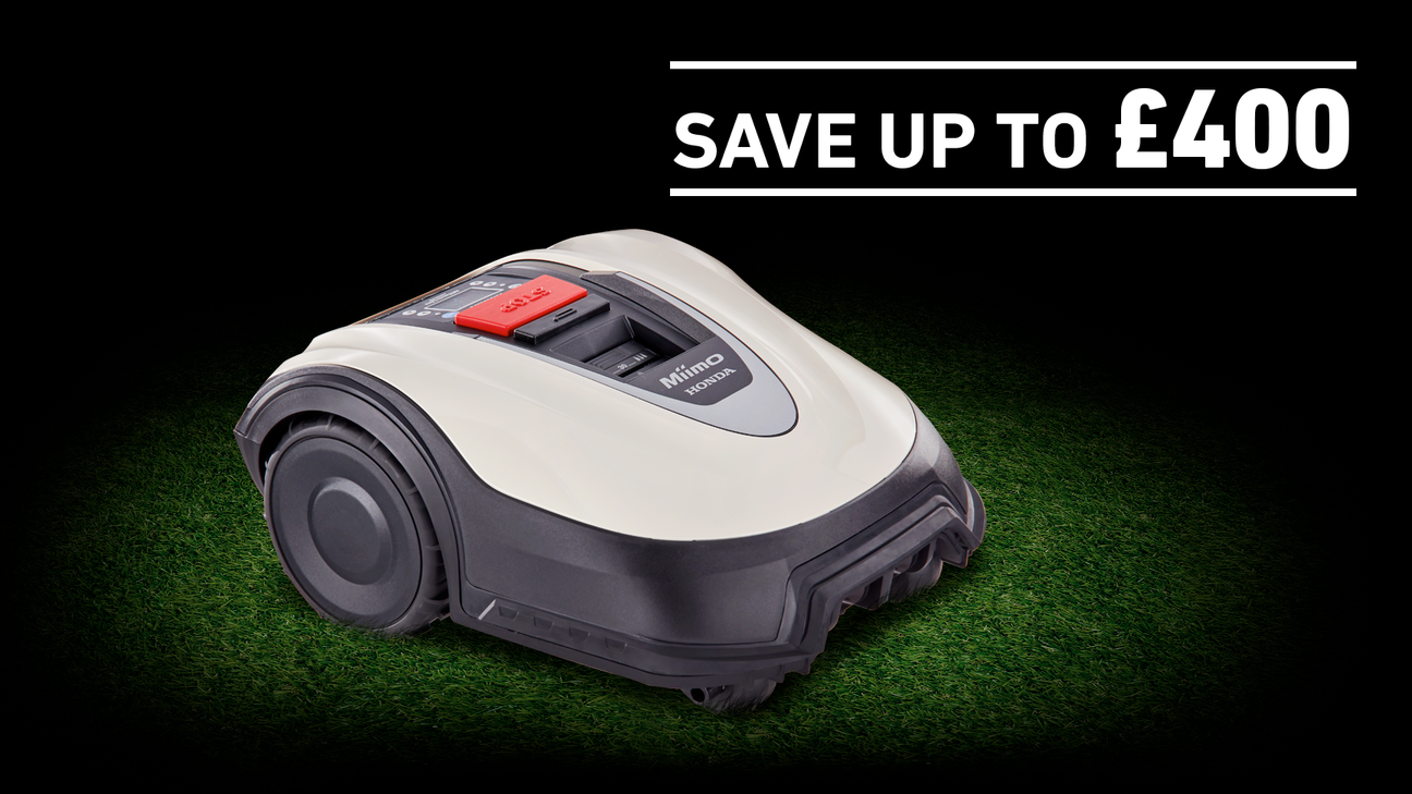 Honda Miimo on grass in a dark background with save £400