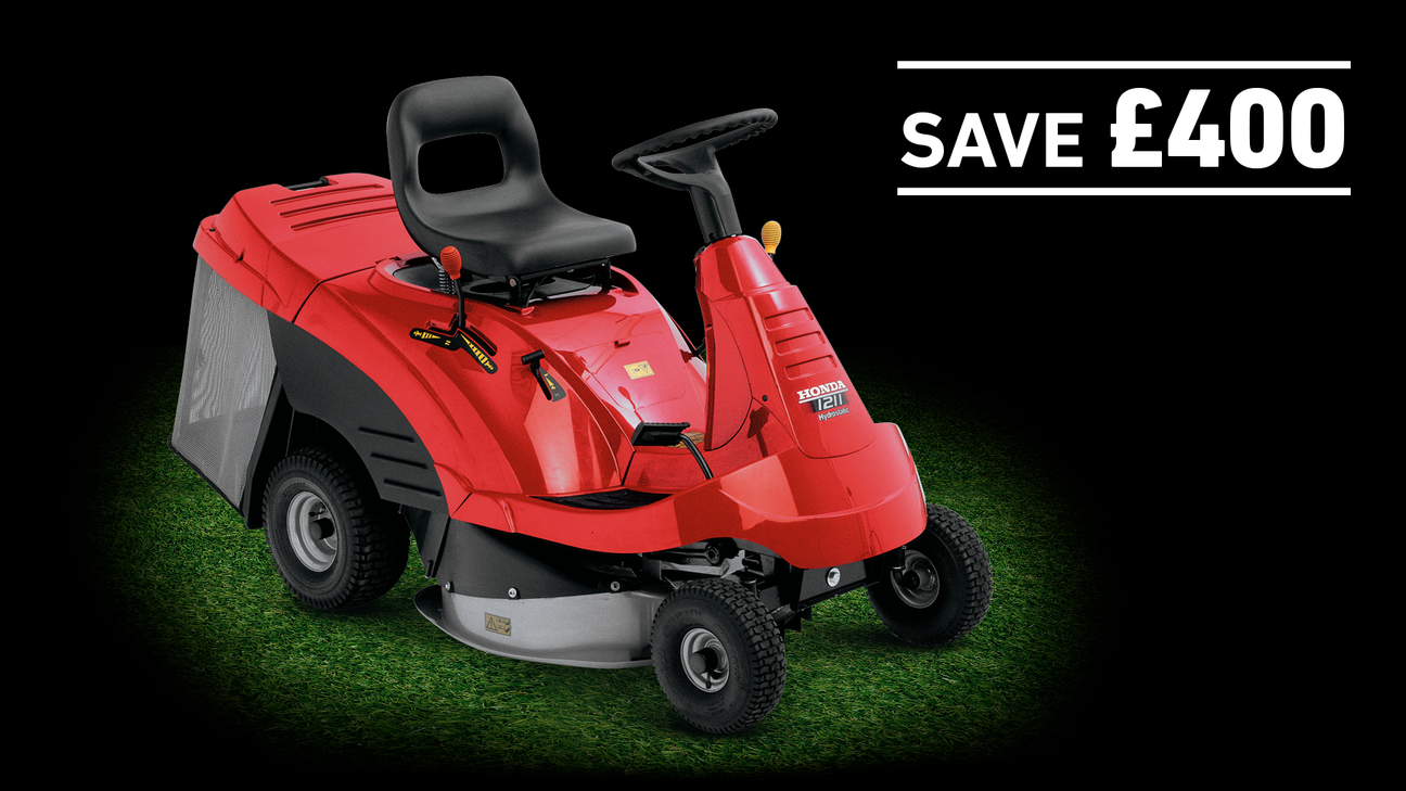 Honda Ride-On mower on grass in a dark background with save £400