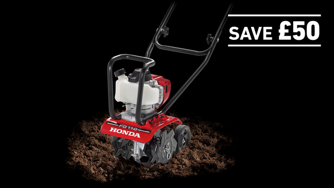 Micro Tiller in soil on a dark background with Save £50