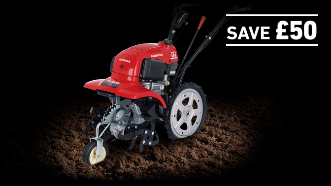 Rotary Tiller in soil on a dark background with Save £50