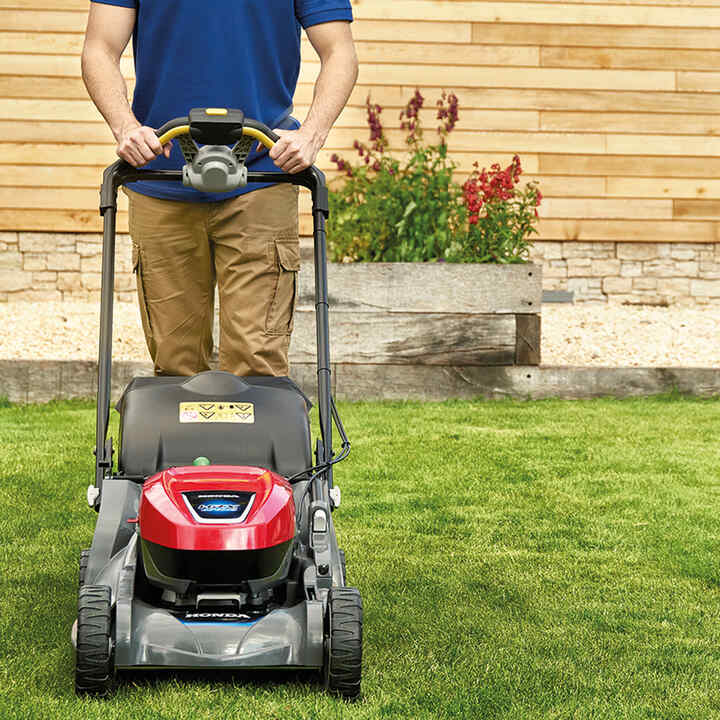 HRX Cordless battery lawn mower mowing the grass.