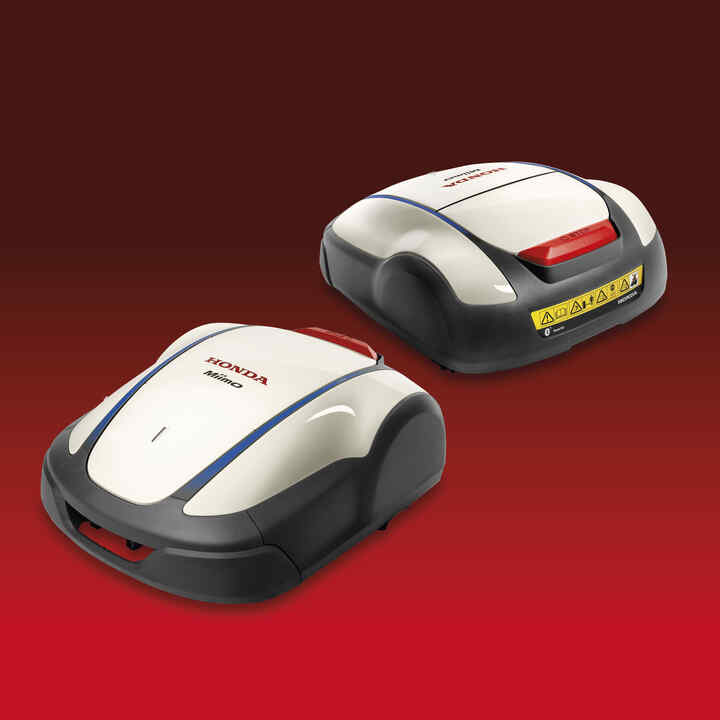 Honda Miimo robotic lawnmower on a red and black gradient background