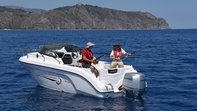 People fishing on a ranieri boat with a Honda marine outboard engine