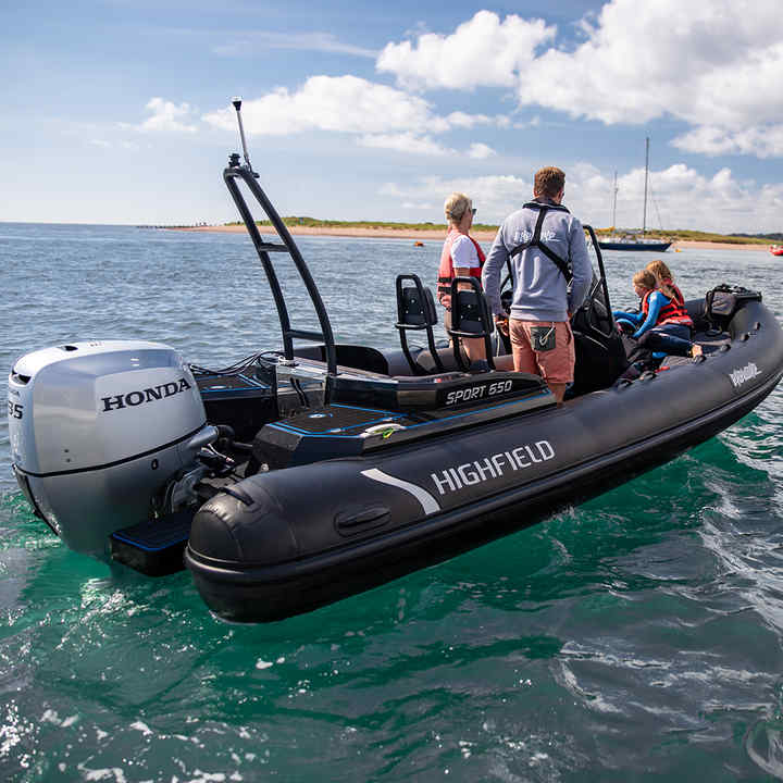 Highfield RIB from behind with a Honda outboard engine, being used on the River Exe