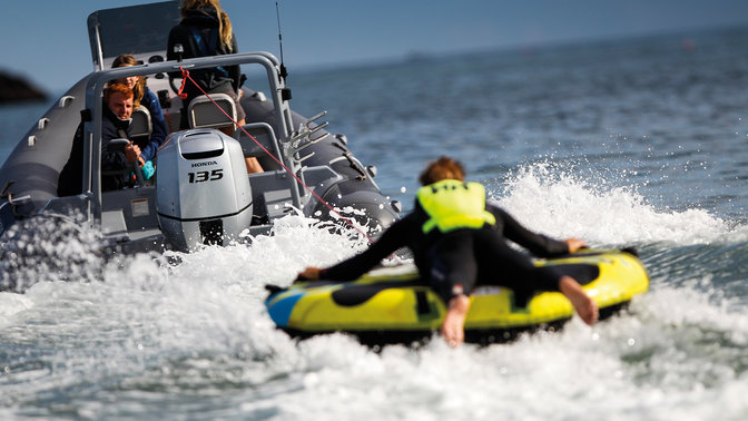 Man driving Highfield RIB with 2 female passengers