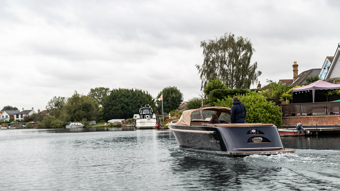 Man and lady on a Maxima boat with a Honda engine on the thames in London