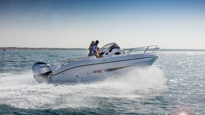 Ranieri boat being driven across the open water with a Honda Marine outboard engine